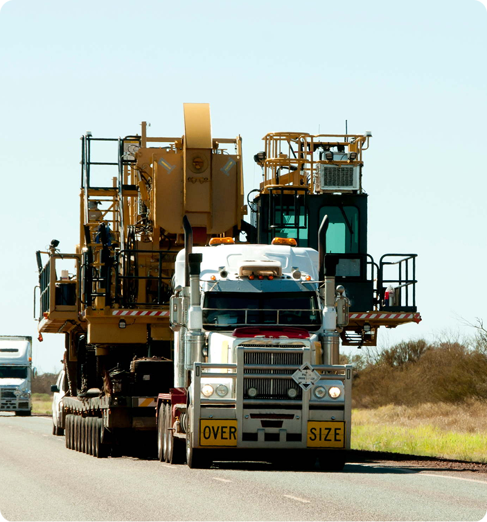 Oversized load transportation with permits and escort coordination
